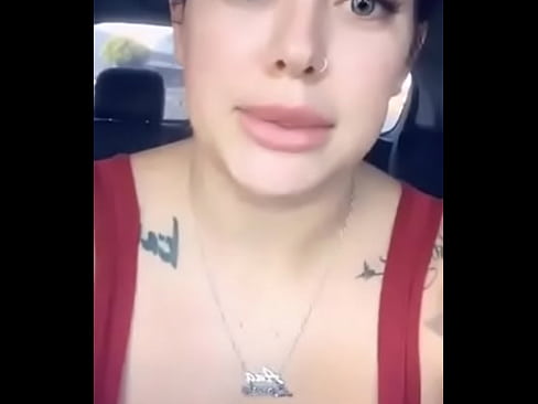 busty woman masturbates in the car in plain sight.