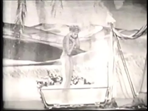 Cute blonde takes a bath in an old movie