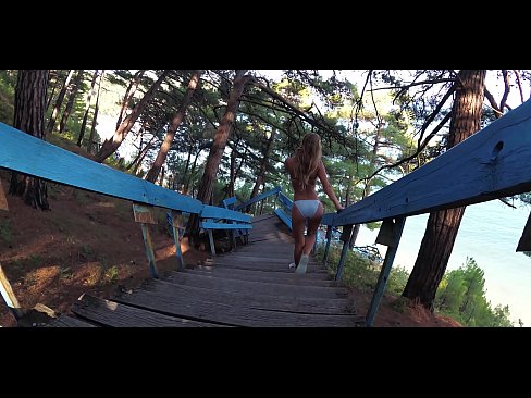 Russian PORNSTAR TRAVELER - Young girl tourist Sasha Bikeyeva in a bikini walks on the coast of the Black Sea in Russia