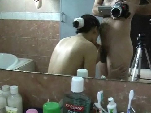 Mature Chinese MILF blowjob in bathroom