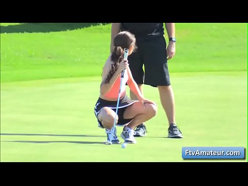 Sexy hot girl gets naked outdoor where people play golf