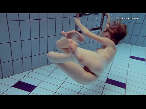 Petite cute Nastya swims underwater nude