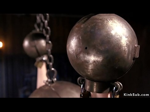 Brunette slut Charlotte Sartre in bondage with huge metal ball on her head and on her hands suffers torment