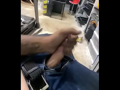 White guy strokes his dick while at work
