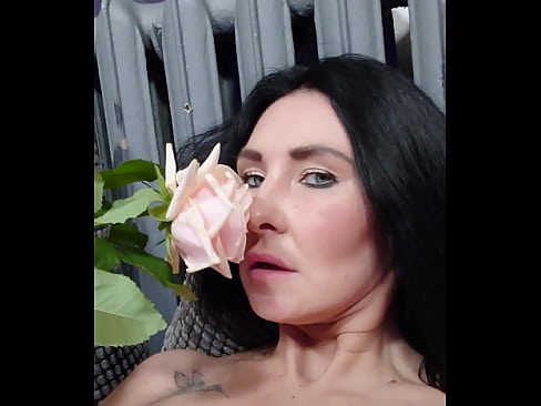 MILF enjoys the touches of a rose