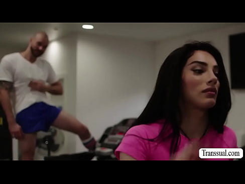 Bald guy cant stop starring at the ass of busty shemale while working out.After that,he licks her ass and barebacks it.