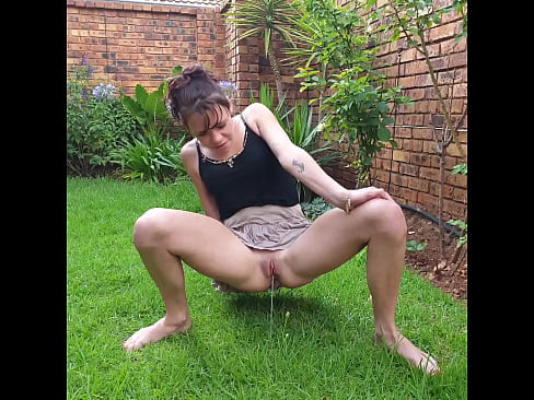 Having some booty shaking fun outside and pissing at the same time