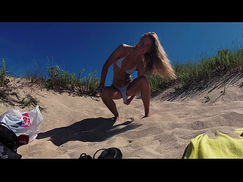 Travel Show Public Babe Pissing - Cute young nudist girl pees outdor on the public beach on the coast of the Atlantic Ocean