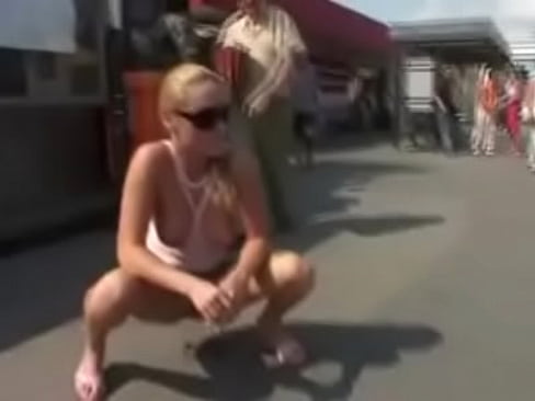 Blonde pee in street