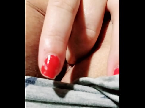 Redhead slut uses her finger for some anal fun
