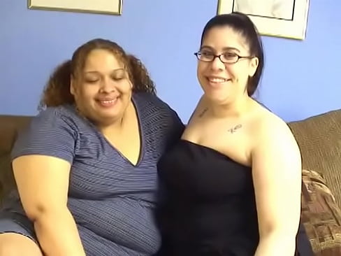 Two BBW lesbians Lulu Garcia and Nikki have fun with a strap on