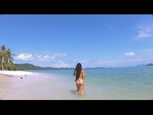 Hot brunette wear micro bikini on a beach and tease  Hot brunette wear micro bikini on a beach and tease