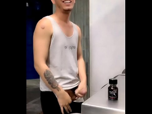 Horny young Asian guy shows off his cock in public toilet!