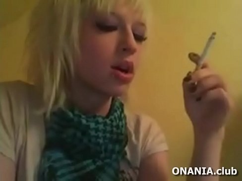 Cute girl smoking cigarette and playing video game