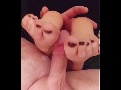 Amateur redhead massaging cock with beautiful creamy feet