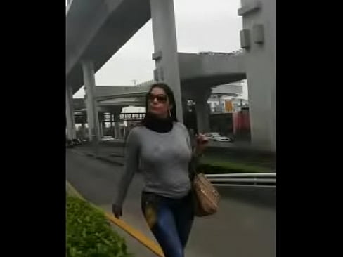Busty latina walking on the street bouncing her huge boobs