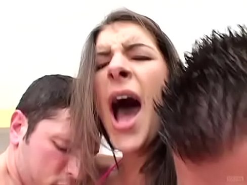 This cute brunette babe can easily manipulate those two big schloengs with her fuck holes