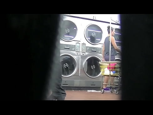 I flash upskirt in front of a young man at the laundry because Im an exhibitionist and love exposing herself to a voyeur Pt 2