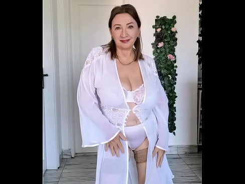 Hot GILF elegantly stripping in a sexy dance