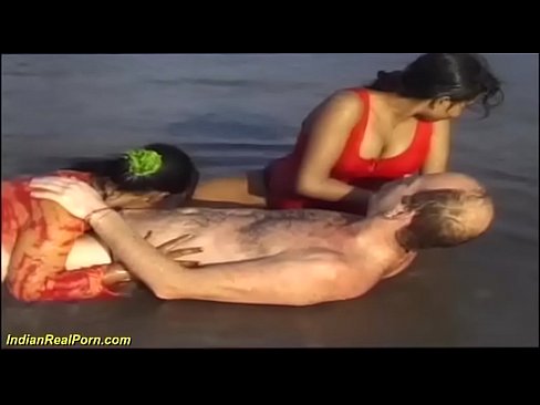 desi indian girls playing with a white tourist at the beach
