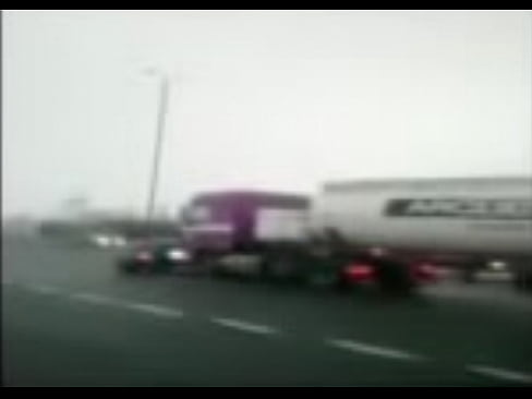Semi Pushes Car Down Freeway