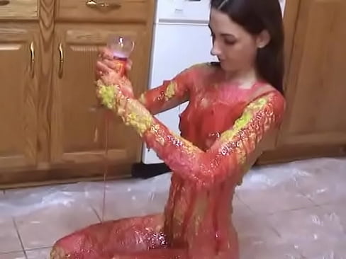 Sexy petite Summer Tyme hand paints her skin in the food coloring