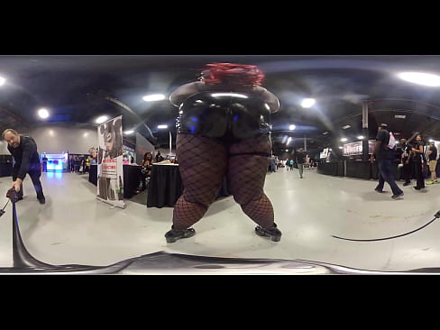Dominatrix shows off body at porn convention