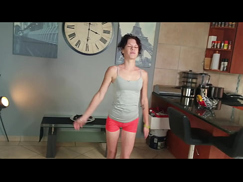 Skinny brunette urinating in pants while stretching