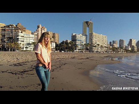 Risky masturbation on a public beach in Benidorm. Fetish Wet Sneakers. The girl pees beautifully in jeans. Fingering. Russian pornstar Sasha Bikeyeva
