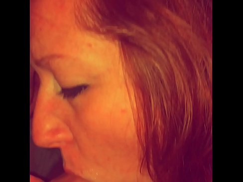 Redhead sucks and gets cum all over her face