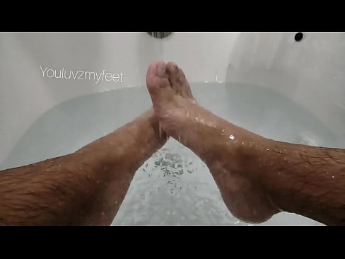Slowmo man feet bathtub