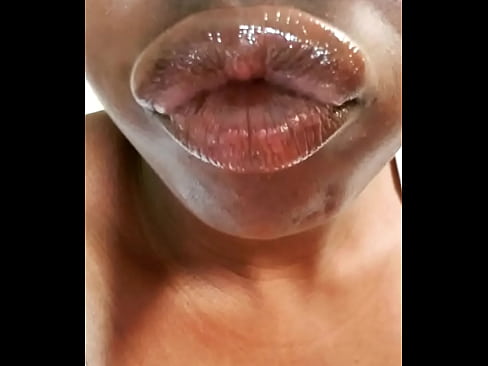 Ebony glossy lips on display