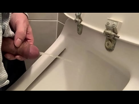 Man using urinal