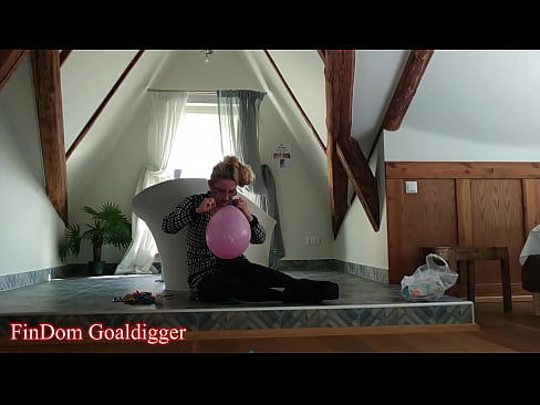 Girl blows balloons in big glasses in bathroom part 1