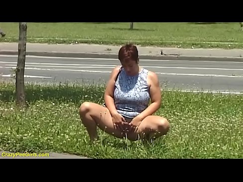 redhead bbw milf peeing on public street while she sucks her big natural breasts