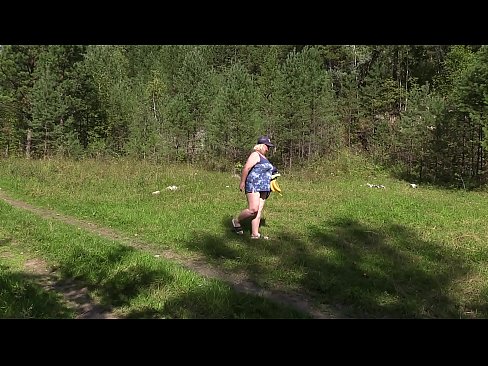 Voyeur in nature spying on a mature BBW. A mom in a public clearing undresses, sunbathes and fucks with a banana. Natural boobs, juicy booty and overgrown cunt.