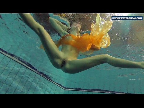 Yellow and Red clothed teen underwater
