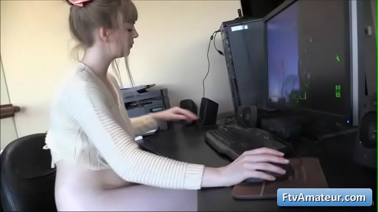 Sexy teen natural big tit girl gets horny while playing at the computer and fucks her pussy with dildo