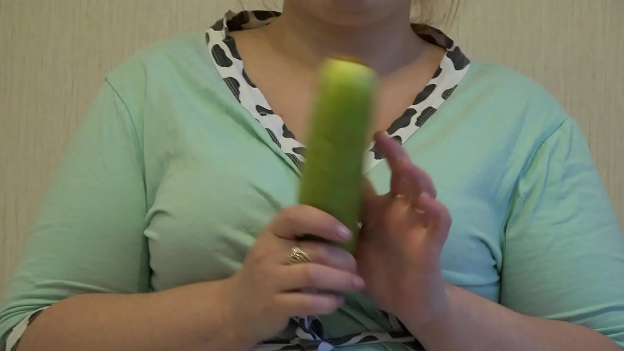 A fat MILF puts a big zucchini in her hairy cunt and fucks to orgasm.