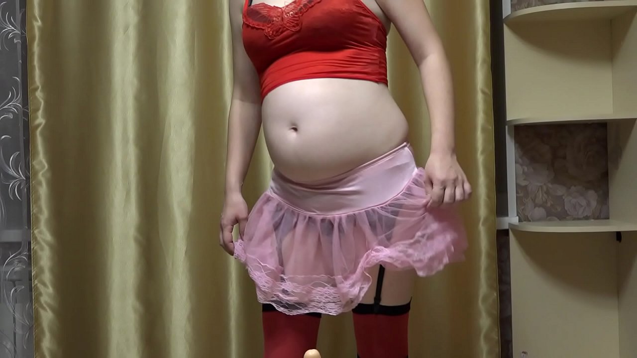 A mom in early pregnancy in a sexy outfit masturbates with a rubber dick. Juicy ass and overgrown cunt.