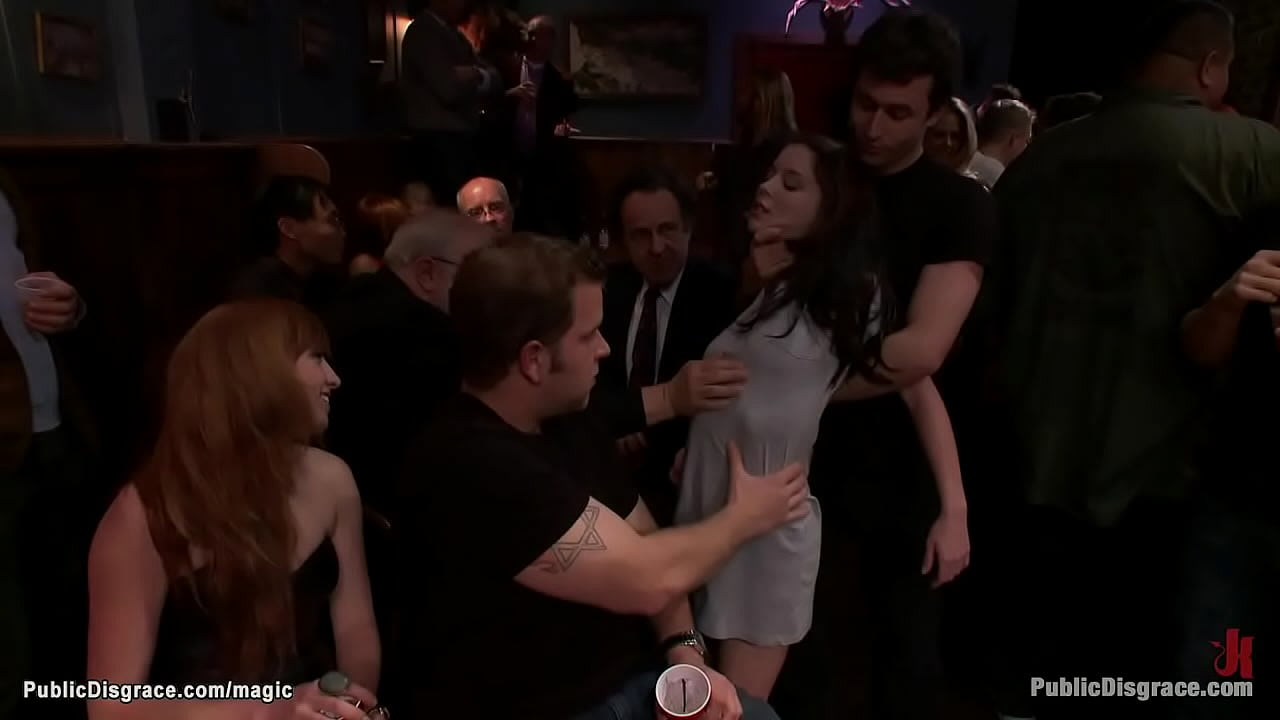 Small tits petite brunette babe Jessi Palmer is suspended by pigtails and ankles and then rough fucked by big dick master James Deen in public crowded bar`