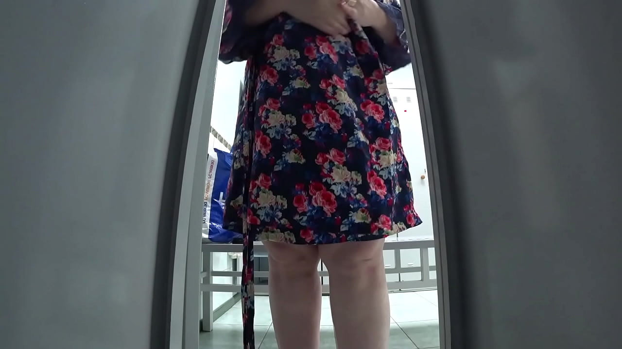 Hidden camera in a cubicle in a public locker room caught a fat mommy with an appetizing booty and saggy tits in her lens. Peeping.