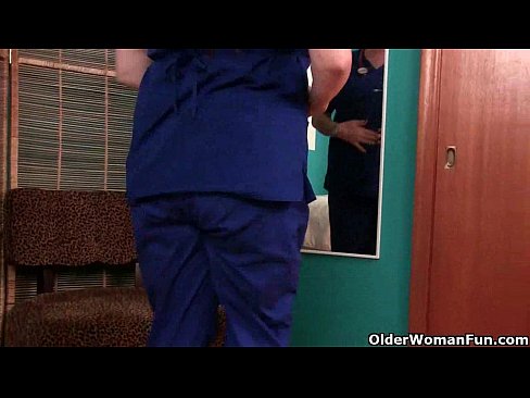 Busty in nurse uniform and stockings masturbates