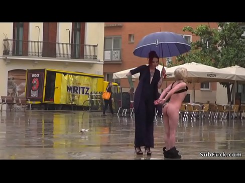 Petite blonde Spanish slave Nora Barcelona and her tall mistress walking on the rain and mistress disgraces her