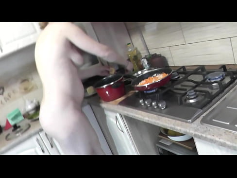 MILF naked woman continues to cook nude in kitchen