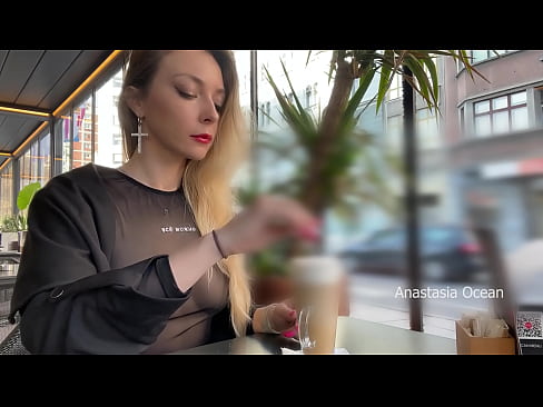 Drinking coffee and flashing boobs in cafe with people around.