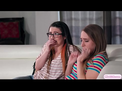 Gorgeous blonde and sexy brunette rent the same house for vacation.They decide to share the house and a few moments,they watch together horror movies.After that,they start kissing each other and they lick their wet pussies on the couch.