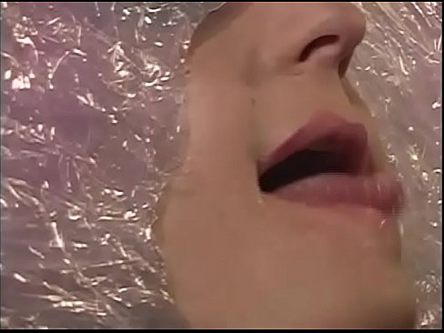 A sexy slave wrapped in the cellophane is fucked doggystyle in the bathroom