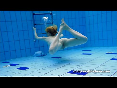 Cute Lucie is stripping underwater