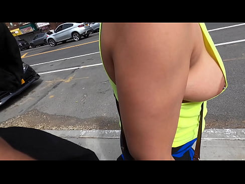 Wife walking  in public braless with nip slipping out